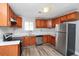 Modern kitchen with wood cabinets, stainless steel appliances, and lots of counter space at 2222 Mcafee Rd, Decatur, GA 30032
