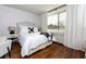 Well-lit bedroom with hardwood floors and a comfortable bed at 2479 Peachtree Rd # 210, Atlanta, GA 30305