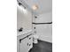 Modern bathroom with white tile, dark accents, and sleek fixtures providing a stylish space at 2645 Shadow Woods Ne Cir, Marietta, GA 30062