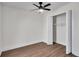 Cozy bedroom with hardwood floors, ceiling fan, and closet at 2645 Shadow Woods Ne Cir, Marietta, GA 30062