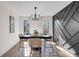 Modern dining room with dark gray geometric wall and chandelier at 2645 Shadow Woods Ne Cir, Marietta, GA 30062