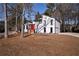 Charming home with modern design, a red front door, and an inviting facade at 2645 Shadow Woods Ne Cir, Marietta, GA 30062