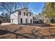 Charming white home with black trim, attached garage, and large deck backing to woods at 2645 Shadow Woods Ne Cir, Marietta, GA 30062