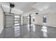 Spacious three-car garage with windows and epoxy flooring for the auto enthusiast at 2645 Shadow Woods Ne Cir, Marietta, GA 30062