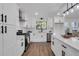 Modern kitchen with white cabinets, stainless steel appliances, and a large island at 2645 Shadow Woods Ne Cir, Marietta, GA 30062