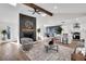 Open-concept living room featuring a fireplace, modern decor, and seamless flow into the kitchen at 2645 Shadow Woods Ne Cir, Marietta, GA 30062