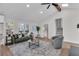 Living area with vaulted ceiling, hardwood floors, and green sofa at 2645 Shadow Woods Ne Cir, Marietta, GA 30062