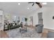 Open living space with high ceilings, seamlessly connects the kitchen, staircase, and blends modern style and comfort at 2645 Shadow Woods Ne Cir, Marietta, GA 30062
