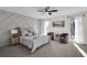 Spacious main bedroom with ample natural light, neutral color palette and decorative accent wall at 2645 Shadow Woods Ne Cir, Marietta, GA 30062