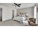Stylish main bedroom with an accent wall, natural light, and sitting area at 2645 Shadow Woods Ne Cir, Marietta, GA 30062