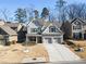 Two-story house with gray siding, brick accents, and a two-car garage at 3230 Harmony Hill Trce, Kennesaw, GA 30144