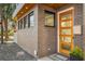 Modern front entrance with wood door and brick facade at 426 Arnold Ne St, Atlanta, GA 30308