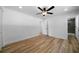Bright bedroom with hardwood floors and access to a bathroom at 4770 Shady Rest Dr, Powder Springs, GA 30127
