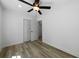 Light-filled bedroom with ceiling fan and wood-look floors at 4770 Shady Rest Dr, Powder Springs, GA 30127