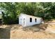 Detached garage with a large door and windows at 4770 Shady Rest Dr, Powder Springs, GA 30127