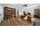 Home office with built-in bookshelves and hardwood floors at 4770 Shady Rest Dr, Powder Springs, GA 30127