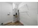 Laundry room with vinyl flooring, shelving, and water heater at 4770 Shady Rest Dr, Powder Springs, GA 30127