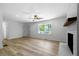 Spacious living room with hardwood floors and fireplace at 4770 Shady Rest Dr, Powder Springs, GA 30127