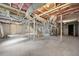 Unfinished basement with exposed pipes and unfinished walls at 1183 Cahaba Dr, Atlanta, GA 30311