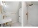 Modern bathroom with walk-in shower, gold fixtures, and hexagon tile at 1183 Cahaba Dr, Atlanta, GA 30311