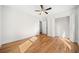 Bright bedroom with hardwood floors, ceiling fan, and large closet at 1183 Cahaba Dr, Atlanta, GA 30311