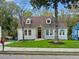 Charming renovated home with light gray exterior, stone accents, and manicured lawn at 1183 Cahaba Dr, Atlanta, GA 30311