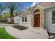 Inviting front entrance with stone details and a modern wood door at 1183 Cahaba Dr, Atlanta, GA 30311