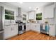 Updated kitchen with white shaker cabinets and stainless steel appliances at 1183 Cahaba Dr, Atlanta, GA 30311