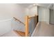 Upper level hallway with staircase and wood railing at 1183 Cahaba Dr, Atlanta, GA 30311