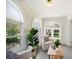 Relaxing sunroom featuring arched windows and comfy seating area at 1183 Cahaba Dr, Atlanta, GA 30311