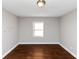 Simple bedroom with hardwood floors and a window at 1368 Wichita Sw Dr, Atlanta, GA 30311