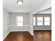 Simple dining room with hardwood floors and lots of natural light at 1368 Wichita Sw Dr, Atlanta, GA 30311