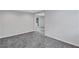 Finished basement room with grey carpet and door to outside at 1641 Pinehurst Sw Dr, Atlanta, GA 30311