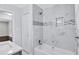 Renovated bathroom with a bathtub, marble tile shower, and built-in niche at 1641 Pinehurst Sw Dr, Atlanta, GA 30311