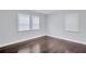 Spacious bedroom with dark hardwood floors and large windows at 1641 Pinehurst Sw Dr, Atlanta, GA 30311