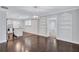 Open concept dining area with hardwood floors and kitchen views at 1641 Pinehurst Sw Dr, Atlanta, GA 30311