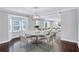 Elegant dining room with a round table and four white chairs at 1641 Pinehurst Sw Dr, Atlanta, GA 30311