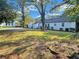 Backyard view showcasing the house's rear elevation and a sizable lawn at 1641 Pinehurst Sw Dr, Atlanta, GA 30311