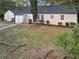 Backyard view of the house and a detached studio, showing a spacious yard at 1641 Pinehurst Sw Dr, Atlanta, GA 30311