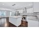 Modern kitchen boasts white cabinets, granite counters, and stainless steel appliances at 1641 Pinehurst Sw Dr, Atlanta, GA 30311