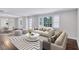 Bright living room features stylish sofas, a coffee table, and a dining area at 1641 Pinehurst Sw Dr, Atlanta, GA 30311