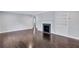 Bright living room with hardwood floors, fireplace, and built-in shelving at 1641 Pinehurst Sw Dr, Atlanta, GA 30311