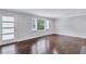 Living room with hardwood floors and a modern glass door at 1641 Pinehurst Sw Dr, Atlanta, GA 30311