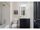 Small bathroom with white subway tile, dark vanity, and a shower/tub combo at 3156 Neal Ct, Cumming, GA 30041