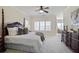 Spacious bedroom with plush bed, large windows, and dresser at 3156 Neal Ct, Cumming, GA 30041