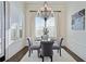 Bright breakfast nook features a glass table, gray chairs, and plantation shutters at 3156 Neal Ct, Cumming, GA 30041