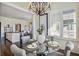 Breakfast nook with glass table, and view into kitchen and living areas at 3156 Neal Ct, Cumming, GA 30041