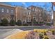 Street view of townhomes, showcasing architectural details and landscaping at 3156 Neal Ct, Cumming, GA 30041