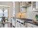 Modern kitchen with double ovens, gas cooktop, and white cabinets at 3156 Neal Ct, Cumming, GA 30041