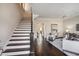 Elegant staircase with dark wood and white risers, leading to upper levels at 3156 Neal Ct, Cumming, GA 30041